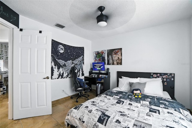 12419 Sion Ct, Orlando, FL 32824 - tiled bedroom with a textured ceiling and ceiling fan