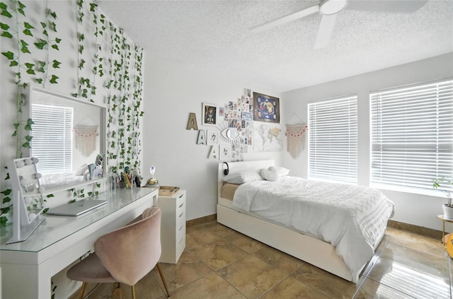 12419 Sion Ct, Orlando, FL 32824 - bedroom featuring a textured ceiling and ceiling fan