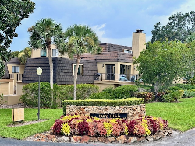 6258 Masters Blvd Unit C204, Orlando, FL 32819 - community sign featuring a yard