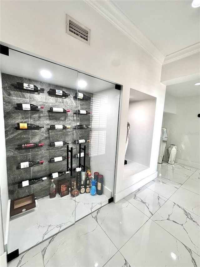 6258 Masters Blvd Unit C204, Orlando, FL 32819 - wine room featuring crown molding and marble finish flooring