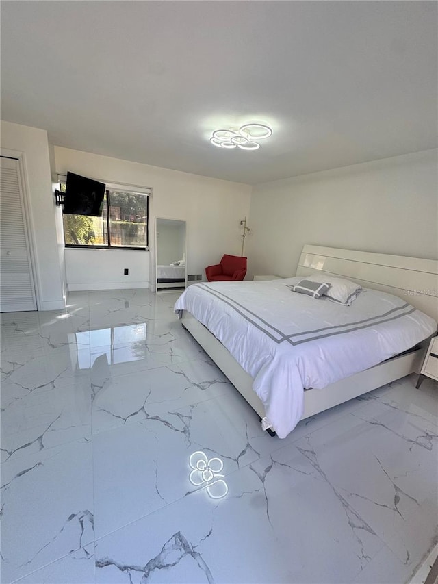 6258 Masters Blvd Unit C204, Orlando, FL 32819 - bedroom featuring marble tiled floors