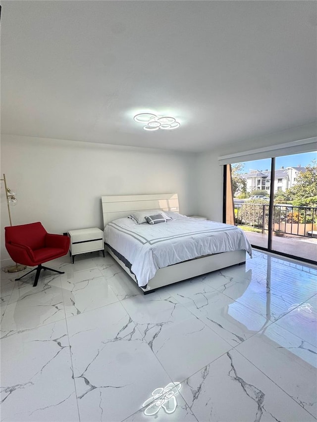 6258 Masters Blvd Unit C204, Orlando, FL 32819 - bedroom featuring light marble finish floors and access to outside
