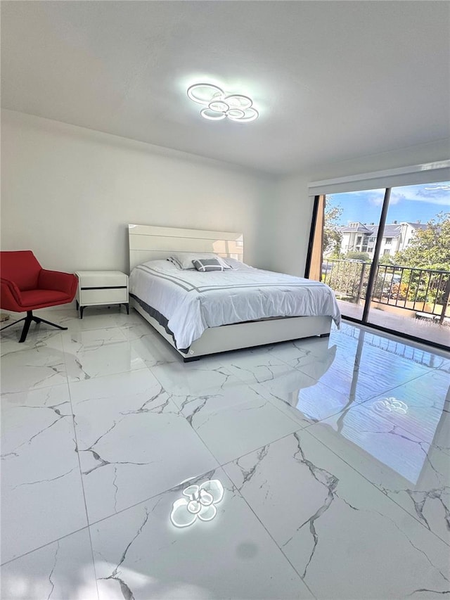 6258 Masters Blvd Unit C204, Orlando, FL 32819 - bedroom with light marble finish flooring and access to outside