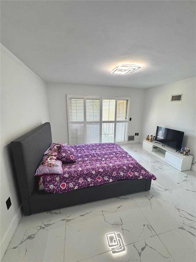 6258 Masters Blvd Unit C204, Orlando, FL 32819 - bedroom with marble finish flooring and baseboards