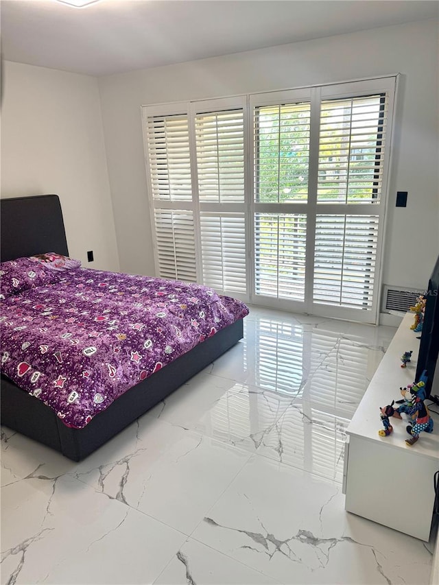 6258 Masters Blvd Unit C204, Orlando, FL 32819 - bedroom featuring light marble finish flooring