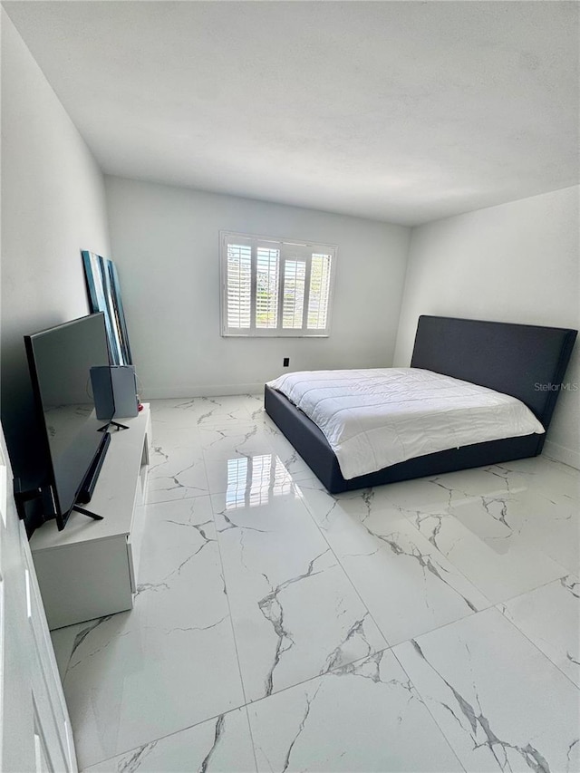 6258 Masters Blvd Unit C204, Orlando, FL 32819 - bedroom featuring marble finish floors