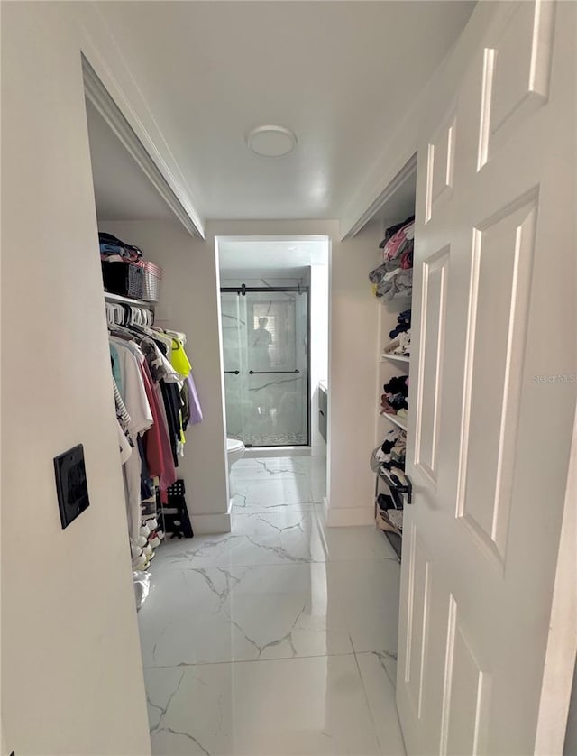 6258 Masters Blvd Unit C204, Orlando, FL 32819 - walk in closet featuring marble finish flooring