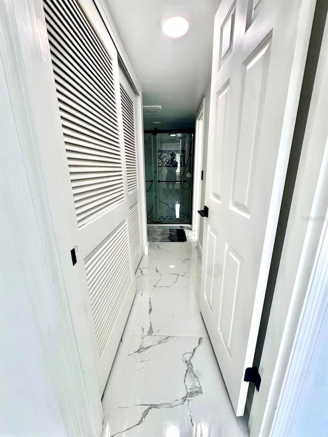 6258 Masters Blvd Unit C204, Orlando, FL 32819 - hallway featuring marble tiled floors and a heating unit
