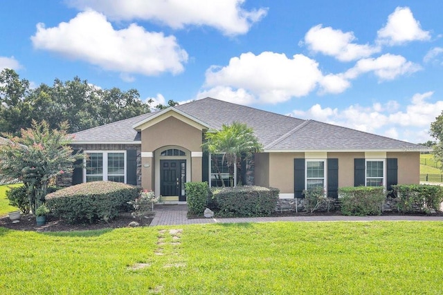 274 Wekiva Pointe Cir, Apopka, FL 32712 - ranch-style house with stucco siding, a front lawn, and roof with shingles