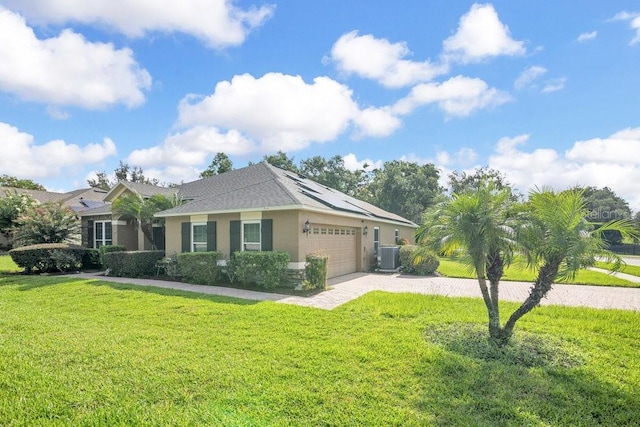 274 Wekiva Pointe Cir, Apopka, FL 32712 - single story home featuring stucco siding, roof mounted solar panels, a front lawn, a garage, and decorative driveway