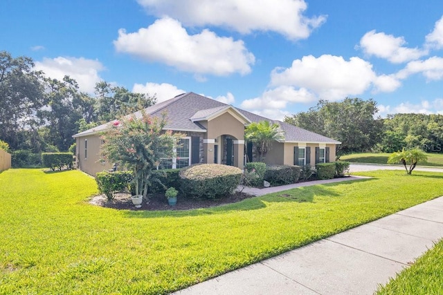 274 Wekiva Pointe Cir, Apopka, FL 32712 - view of front of house with a front lawn and stucco siding