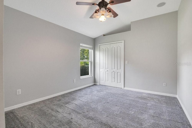 274 Wekiva Pointe Cir, Apopka, FL 32712 - unfurnished bedroom with carpet floors, a closet, lofted ceiling, and ceiling fan