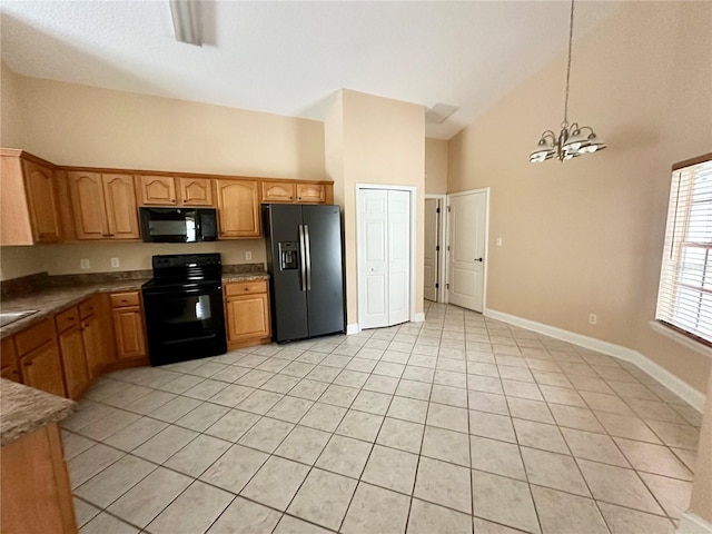 1676 Vick Rd, Apopka, FL 32712 - kitchen with black appliances, light tile patterned floors, high vaulted ceiling, a chandelier, and pendant lighting
