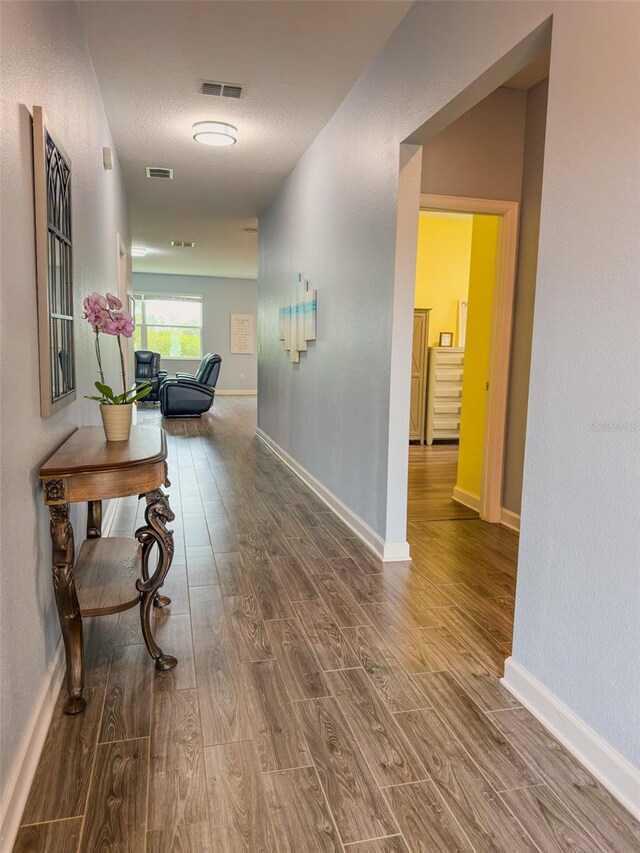 1047 Oak Bluff Dr, Davenport, FL 33837 - hallway with wood finished floors