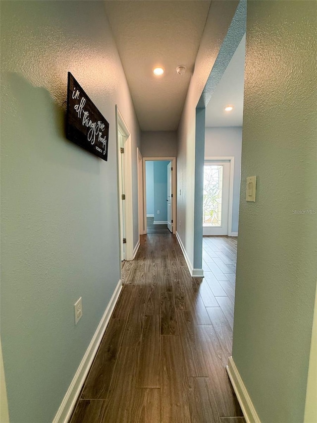 1047 Oak Bluff Dr, Davenport, FL 33837 - hall with dark wood-type flooring, recessed lighting, and a textured ceiling