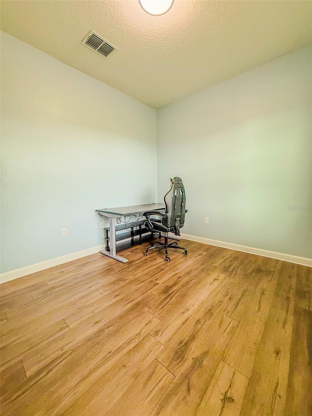 1047 Oak Bluff Dr, Davenport, FL 33837 - miscellaneous room featuring light wood finished floors and a textured ceiling