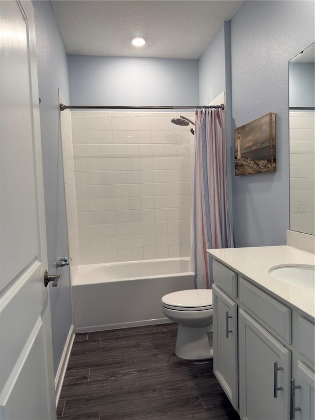 1047 Oak Bluff Dr, Davenport, FL 33837 - bathroom with vanity, shower / bath combination with curtain, wood finished floors, and a textured ceiling