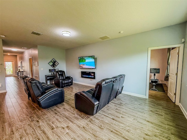 1047 Oak Bluff Dr, Davenport, FL 33837 - living room with wood finished floors and a textured ceiling