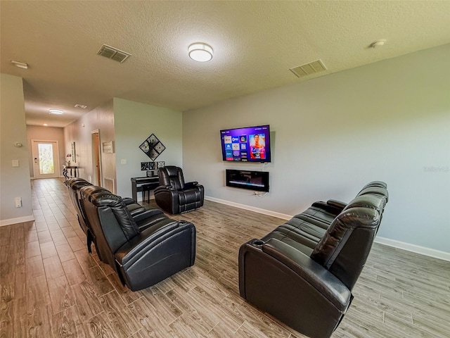 1047 Oak Bluff Dr, Davenport, FL 33837 - living area with wood finished floors and a textured ceiling