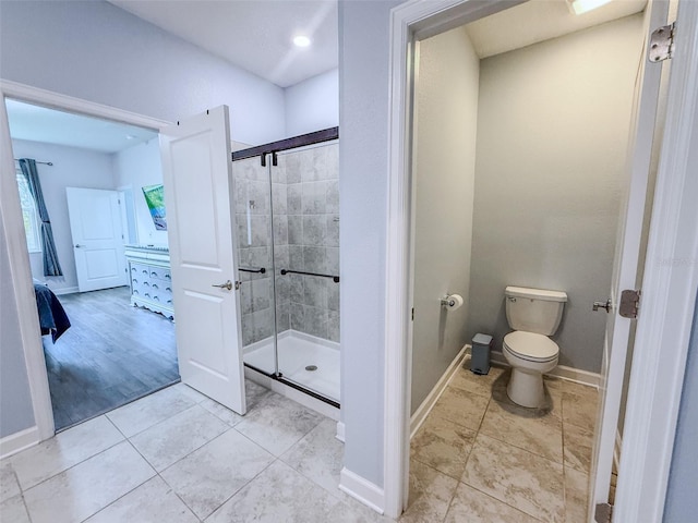 1047 Oak Bluff Dr, Davenport, FL 33837 - ensuite bathroom featuring a stall shower and tile patterned floors