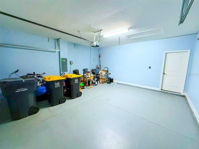 1047 Oak Bluff Dr, Davenport, FL 33837 - garage with electric panel and a garage door opener
