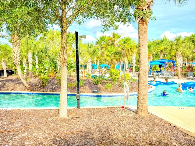 1047 Oak Bluff Dr, Davenport, FL 33837 - outdoor pool with a water play area