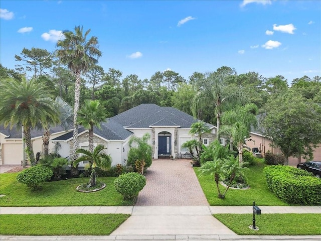 4080 Safflower Ter, Oviedo, FL 32766 - view of front of home with decorative driveway and a front yard