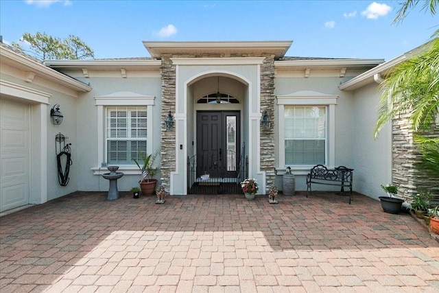 4080 Safflower Ter, Oviedo, FL 32766 - view of exterior entry with stucco siding and stone siding