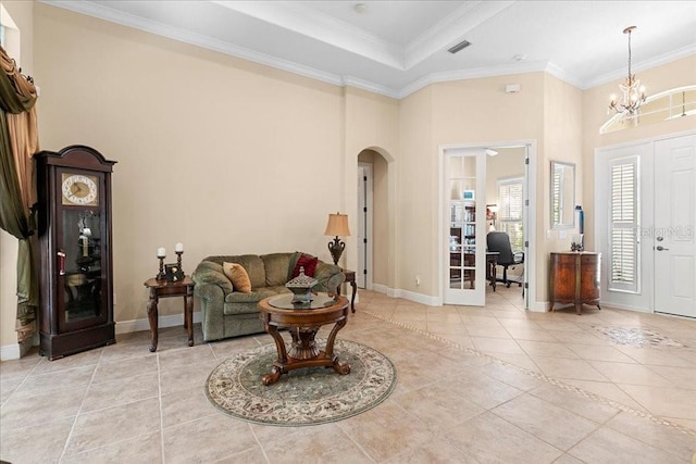 4080 Safflower Ter, Oviedo, FL 32766 - living area with arched walkways, light tile patterned flooring, a chandelier, and crown molding