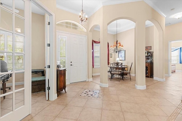 4080 Safflower Ter, Oviedo, FL 32766 - foyer featuring a chandelier, ornamental molding, healthy amount of natural light, and light tile patterned flooring