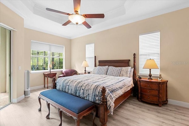 4080 Safflower Ter, Oviedo, FL 32766 - bedroom with a tray ceiling, crown molding, a ceiling fan, and light wood finished floors