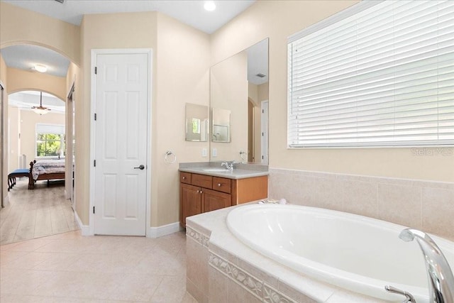 4080 Safflower Ter, Oviedo, FL 32766 - ensuite bathroom with a bath, vanity, and tile patterned floors