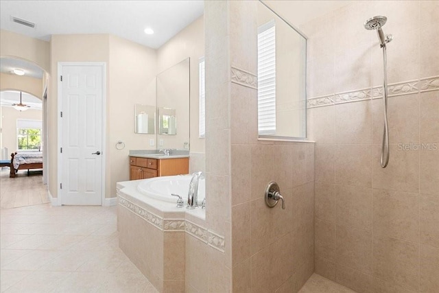 4080 Safflower Ter, Oviedo, FL 32766 - ensuite bathroom featuring a walk in shower, vanity, tile patterned flooring, a bath, and recessed lighting