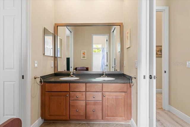 4080 Safflower Ter, Oviedo, FL 32766 - full bath featuring double vanity and wood finished floors