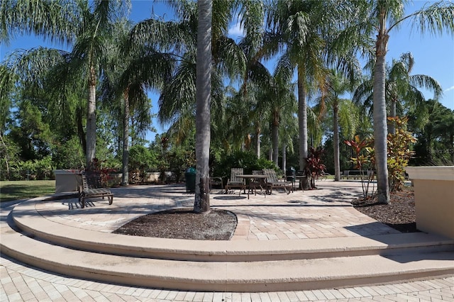 4080 Safflower Ter, Oviedo, FL 32766 - surrounding community featuring a patio area and view of wooded area