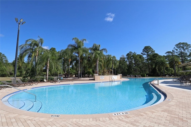 4080 Safflower Ter, Oviedo, FL 32766 - community pool featuring view of scattered trees and a patio area