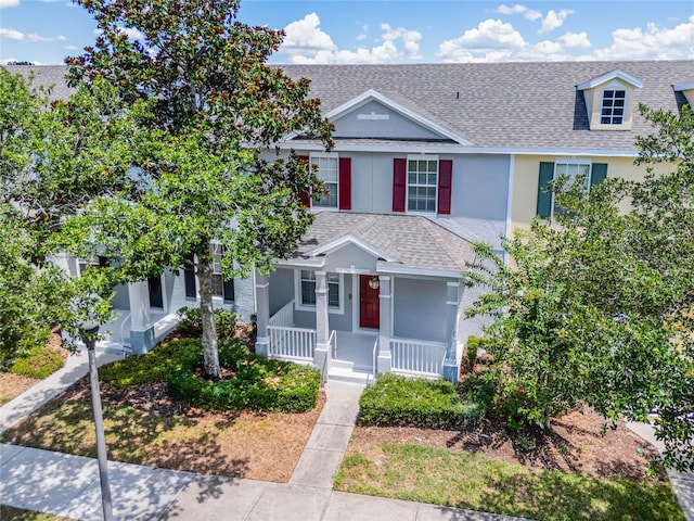 14466 Bridgewater Crossings Blvd, Windermere, FL 34786 - view of property with roof with shingles, a porch, and stucco siding