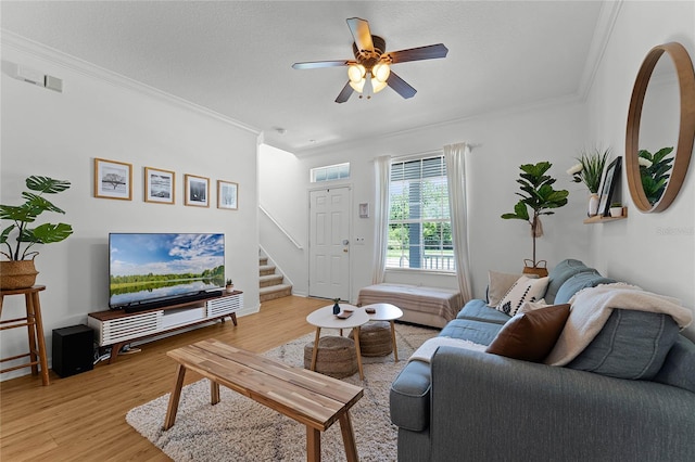 14466 Bridgewater Crossings Blvd, Windermere, FL 34786 - living area with stairs, crown molding, light wood-style flooring, and ceiling fan