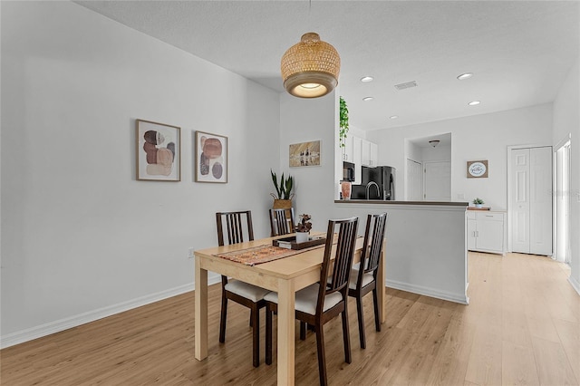 14466 Bridgewater Crossings Blvd, Windermere, FL 34786 - dining room featuring light wood-style floors and recessed lighting