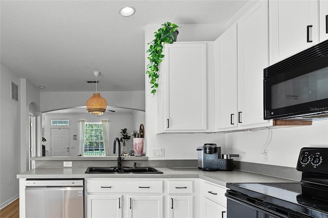 14466 Bridgewater Crossings Blvd, Windermere, FL 34786 - kitchen featuring black appliances, white cabinetry, pendant lighting, and a peninsula
