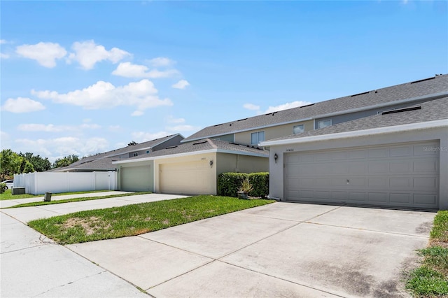 14466 Bridgewater Crossings Blvd, Windermere, FL 34786 - view of front facade featuring stucco siding, concrete driveway, and a garage