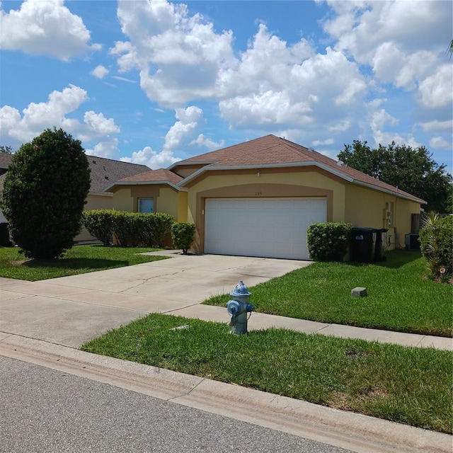 289 White Marsh Cir, Orlando, FL 32824 - ranch-style home featuring stucco siding, driveway, an attached garage, and a front yard