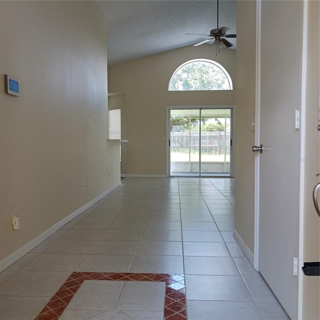 289 White Marsh Cir, Orlando, FL 32824 - hall with tile patterned flooring, a textured ceiling, and high vaulted ceiling