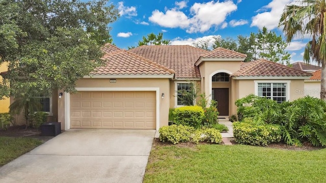 4060 Oak Tree Dr, Davenport, FL 33837 - mediterranean / spanish house featuring an attached garage, concrete driveway, a tiled roof, stucco siding, and a front lawn