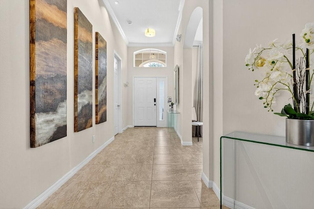 4060 Oak Tree Dr, Davenport, FL 33837 - entryway featuring arched walkways, ornamental molding, and light tile patterned flooring