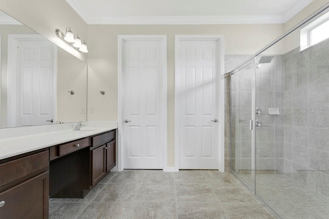 4060 Oak Tree Dr, Davenport, FL 33837 - bathroom with vanity, a shower stall, ornamental molding, and tile patterned floors