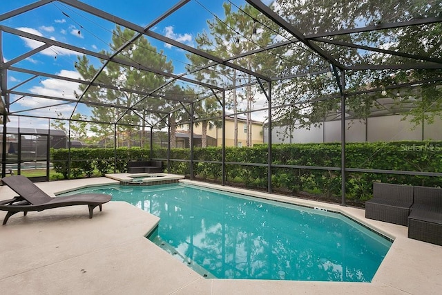 4060 Oak Tree Dr, Davenport, FL 33837 - view of swimming pool featuring a pool with connected hot tub, a patio area, and glass enclosure