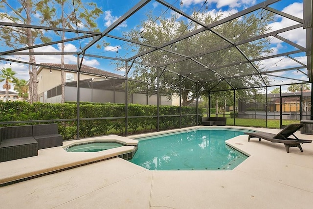 4060 Oak Tree Dr, Davenport, FL 33837 - view of swimming pool featuring a patio, a pool with connected hot tub, and glass enclosure