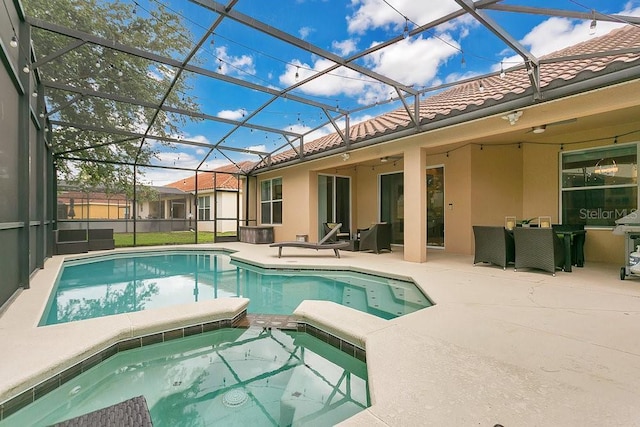 4060 Oak Tree Dr, Davenport, FL 33837 - view of swimming pool with a patio, a pool with connected hot tub, and glass enclosure