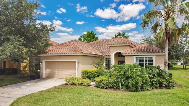 4060 Oak Tree Dr, Davenport, FL 33837 - mediterranean / spanish-style house with an attached garage, a front lawn, stucco siding, driveway, and a tile roof